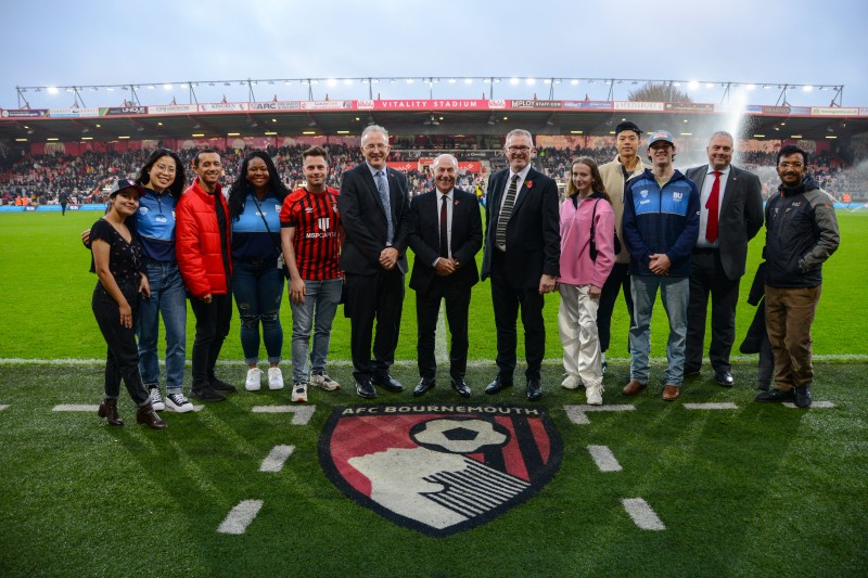 BU staff and students pitch-side at half time